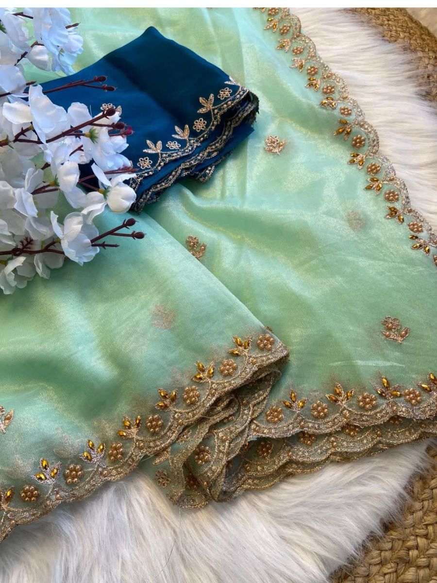 FABRIC : Pure soft twills oranga saree BLOUSE : rangoli heavy satin blouse With handwork